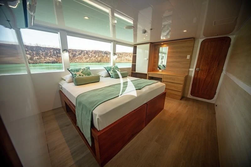 a bed in a room aboard GRAND DAPHNE Yacht for Charter