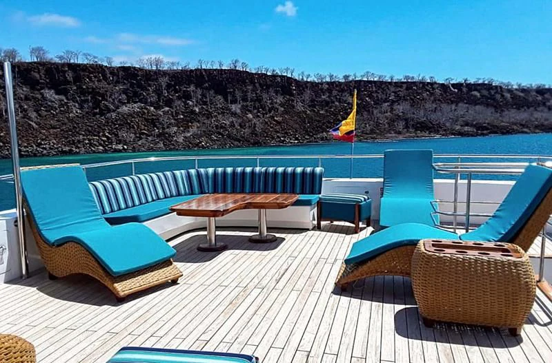 a pool with chairs and tables aboard GRAND DAPHNE Yacht for Charter