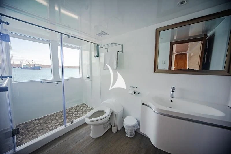 a bathroom with a tub toilet and sink aboard GRAND DAPHNE Yacht for Charter