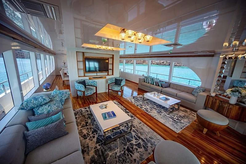 a living room with a large window aboard GRAND DAPHNE Yacht for Charter