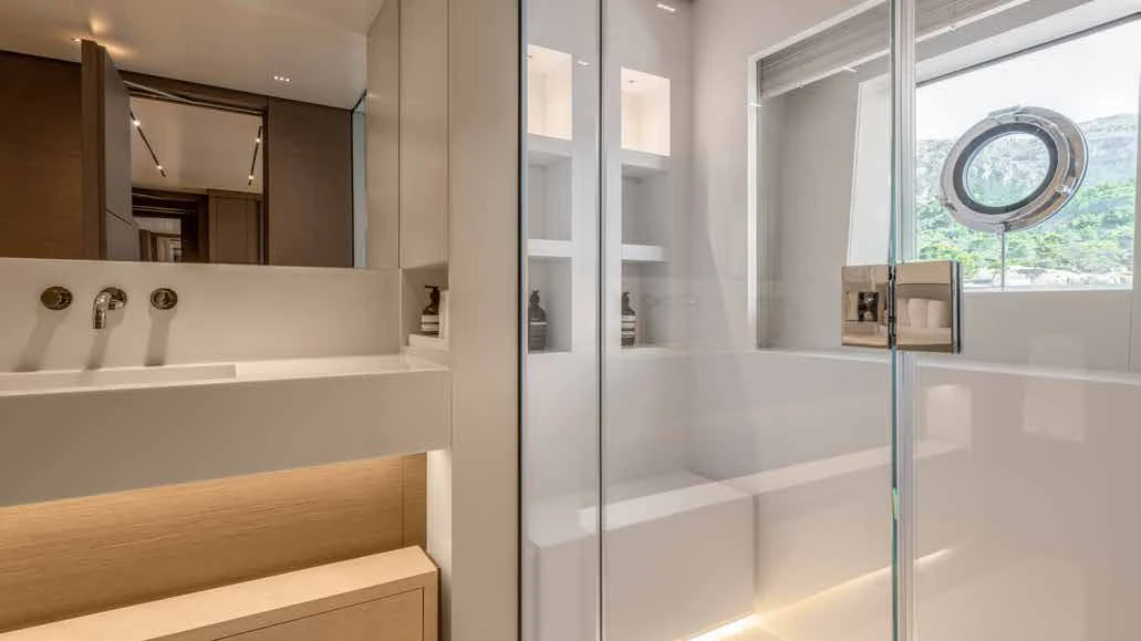 a bathroom with a glass shower aboard PALOMA Yacht for Sale