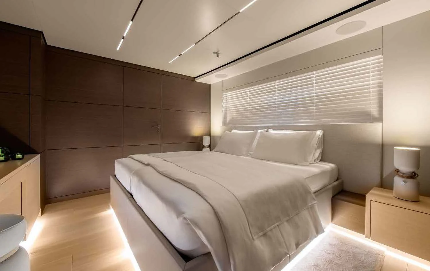 a room with a bed and a wood wall aboard PALOMA Yacht for Sale