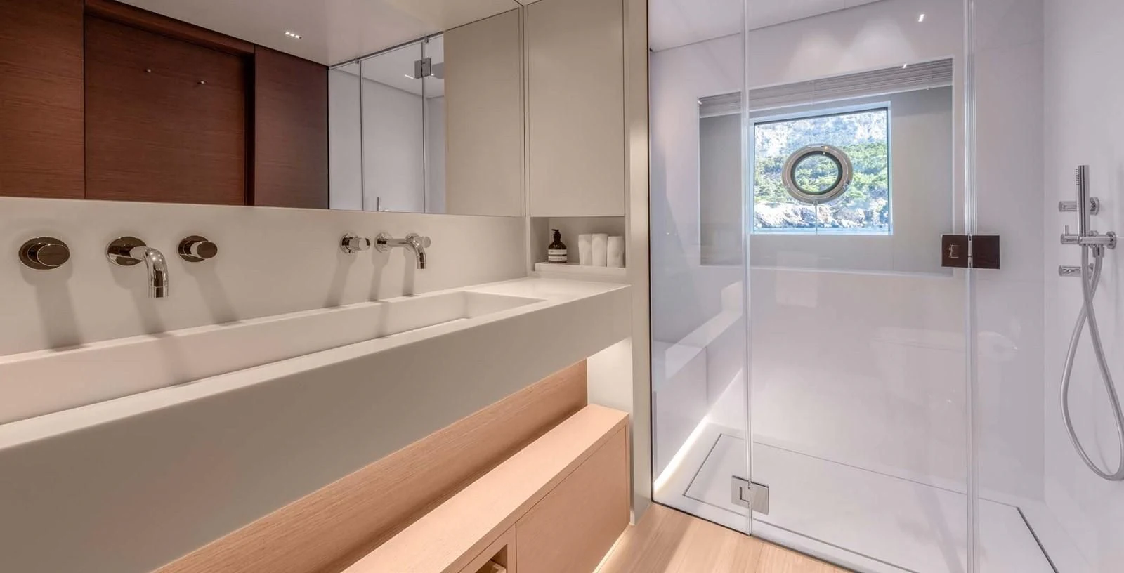 a bathroom with a large window aboard PALOMA Yacht for Sale