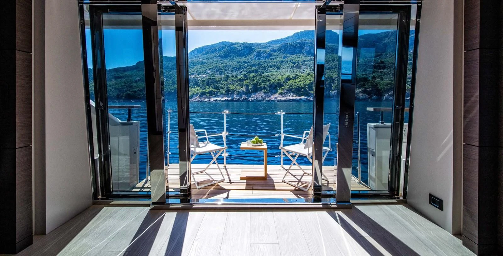 a room with a view of mountains and trees aboard PALOMA Yacht for Sale
