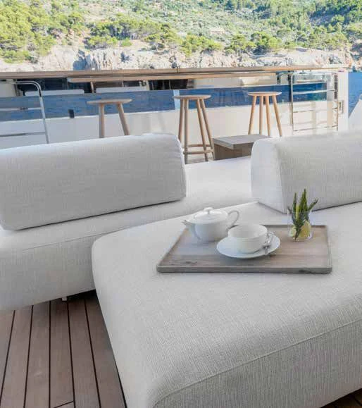 a table with chairs and a couch on it aboard PALOMA Yacht for Sale