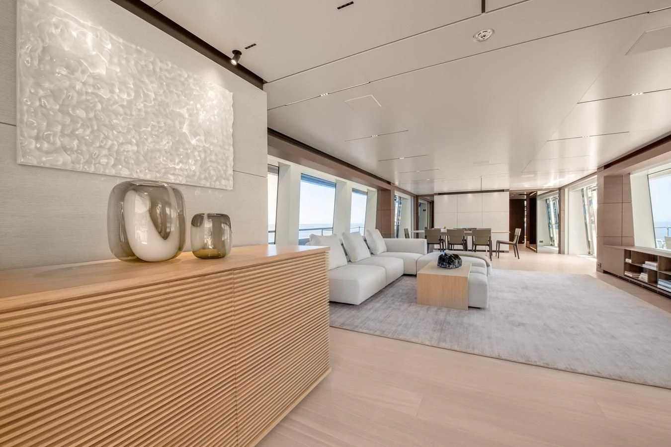 a large living room with a large white wall aboard PALOMA Yacht for Sale