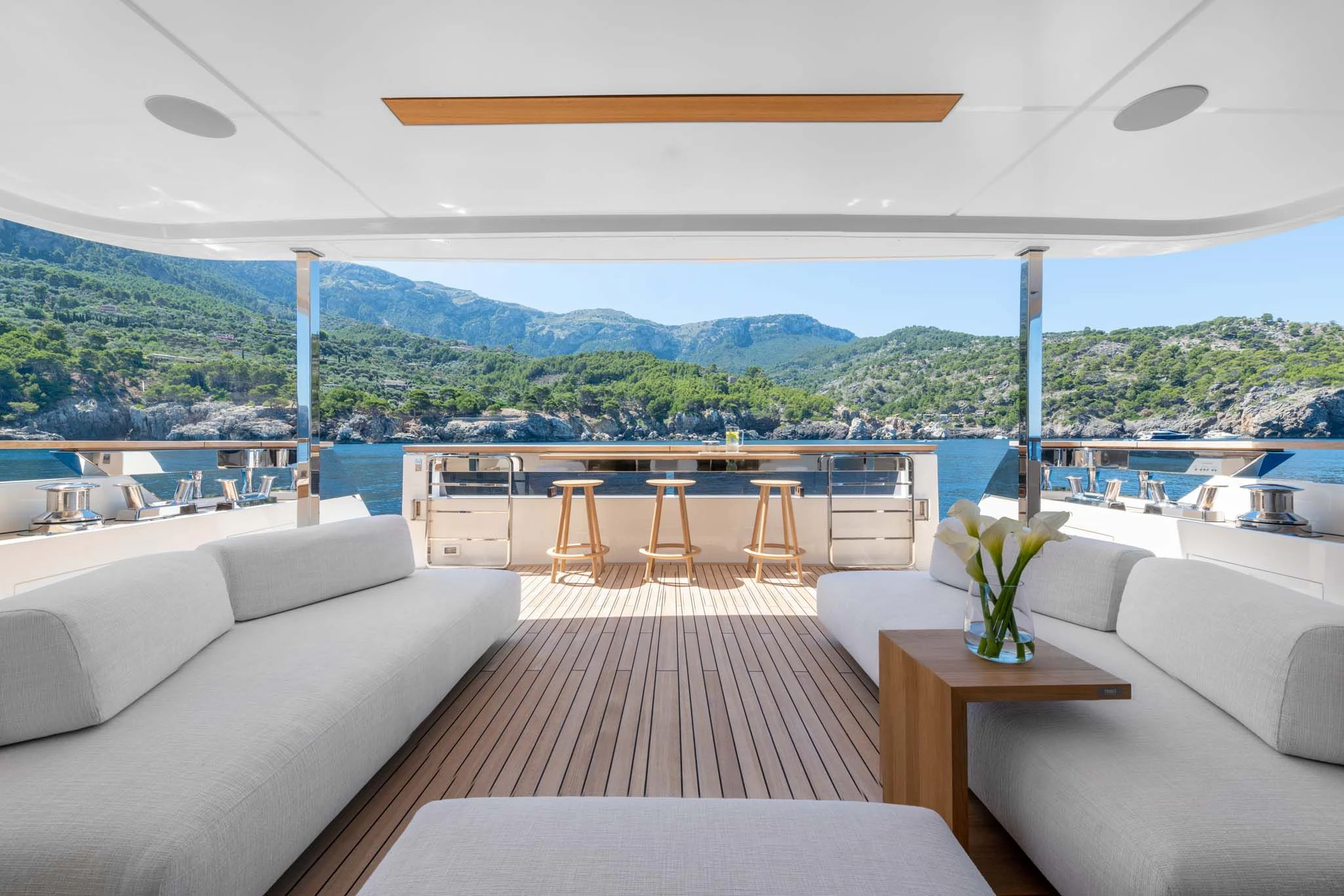 a living room with a large balcony aboard PALOMA Yacht for Sale