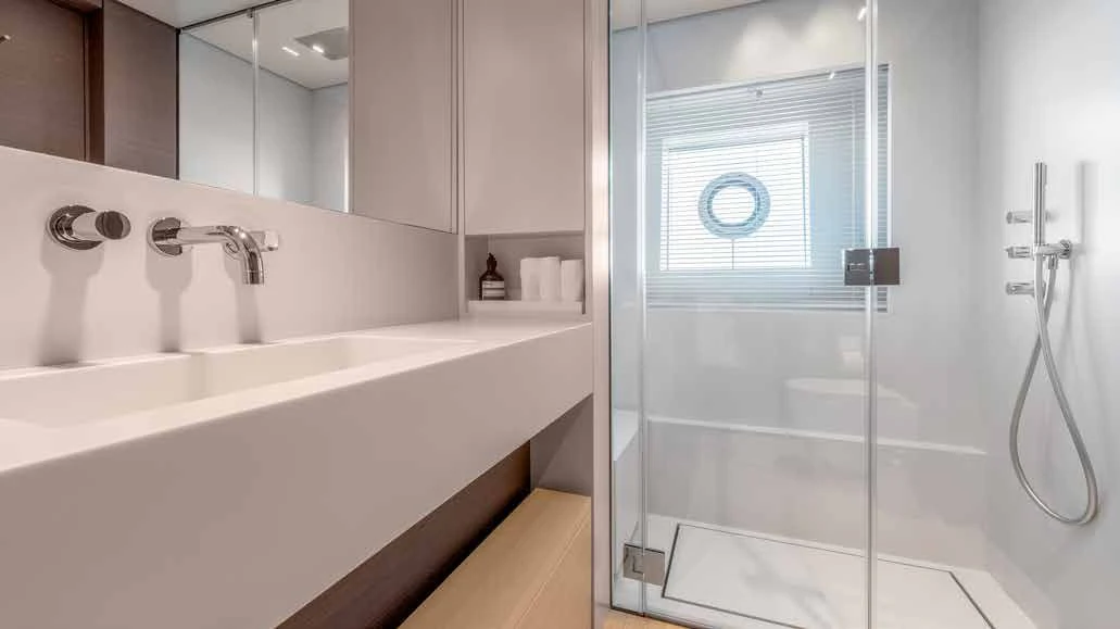 a bathroom with a glass shower aboard PALOMA Yacht for Sale