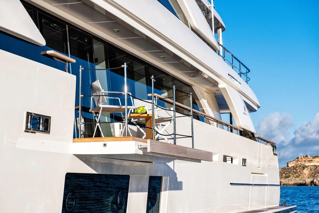 a white house with a staircase aboard PALOMA Yacht for Sale
