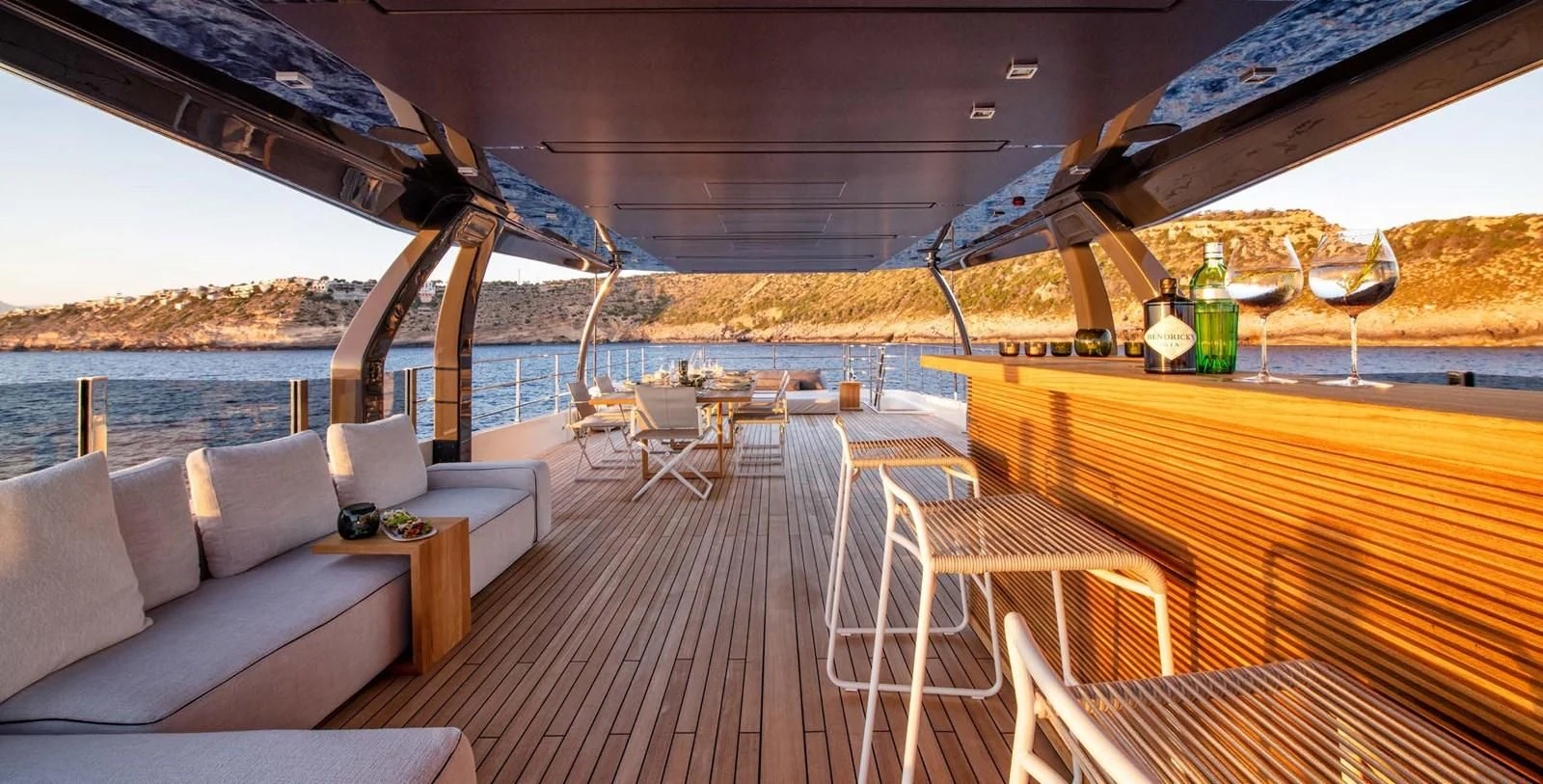 a deck with a couch and a table on it aboard PALOMA Yacht for Sale