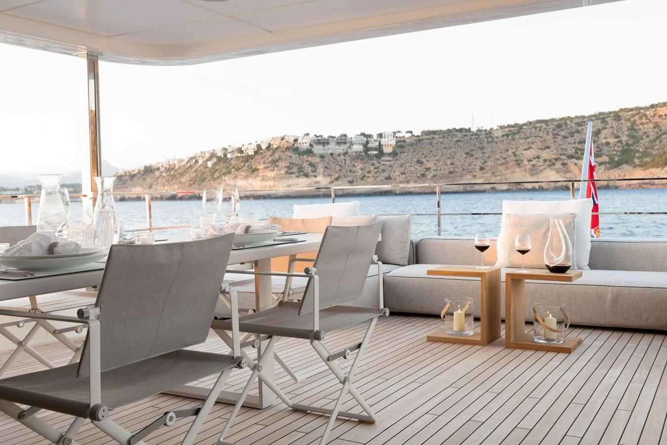 a deck with chairs and a table on it aboard PALOMA Yacht for Sale