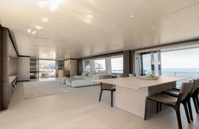 a large modern room with a large table and chairs aboard PALOMA Yacht for Sale