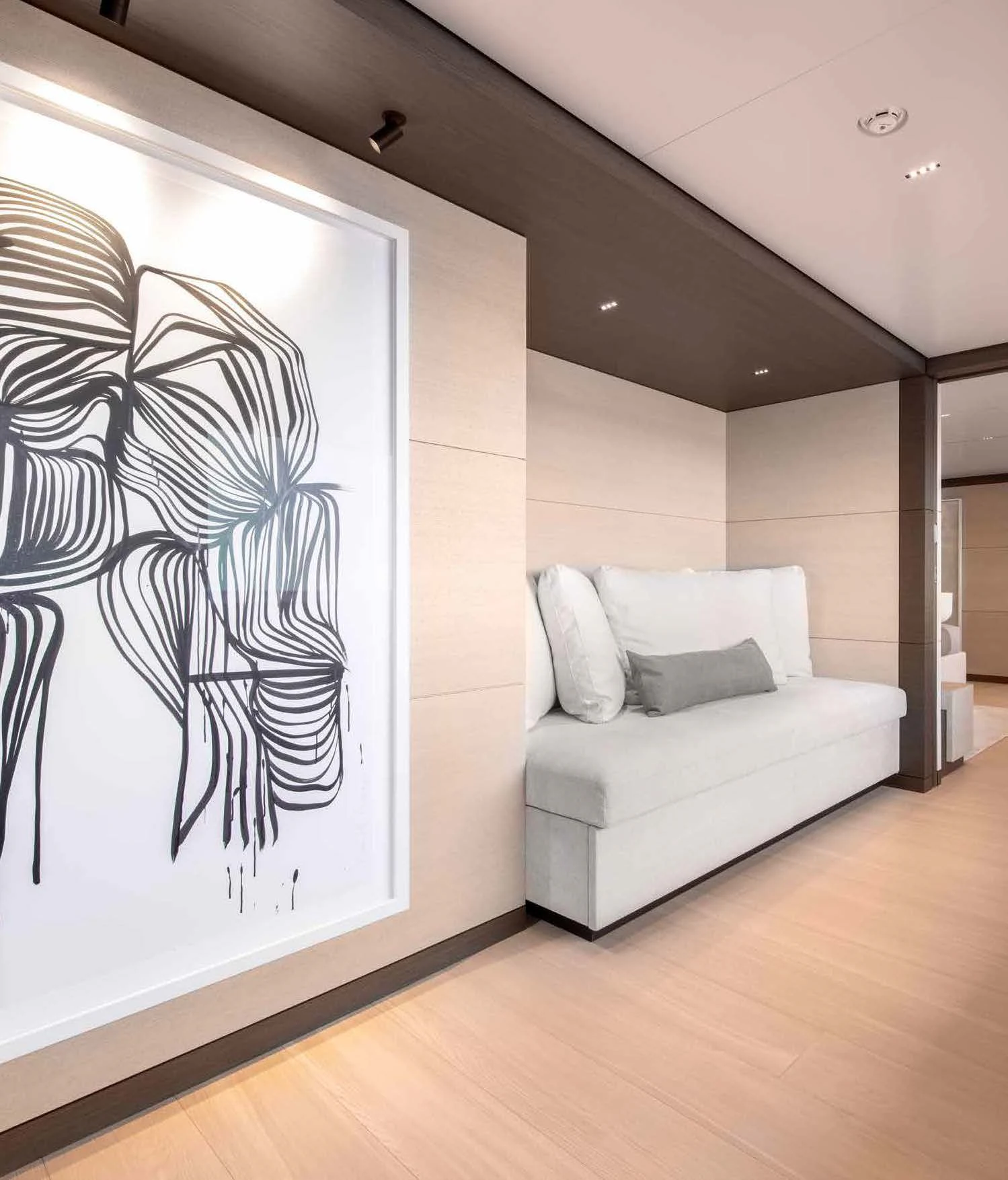 a room with a couch and a mirror aboard PALOMA Yacht for Sale