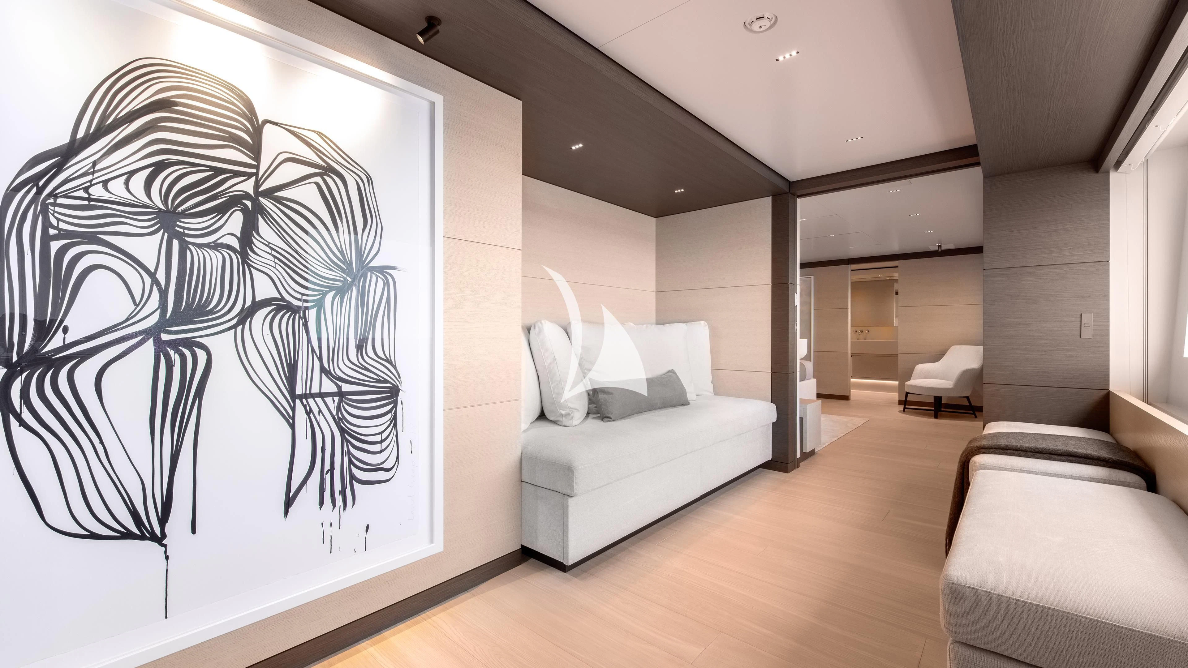 a room with a couch and a bed aboard PALOMA Yacht for Sale