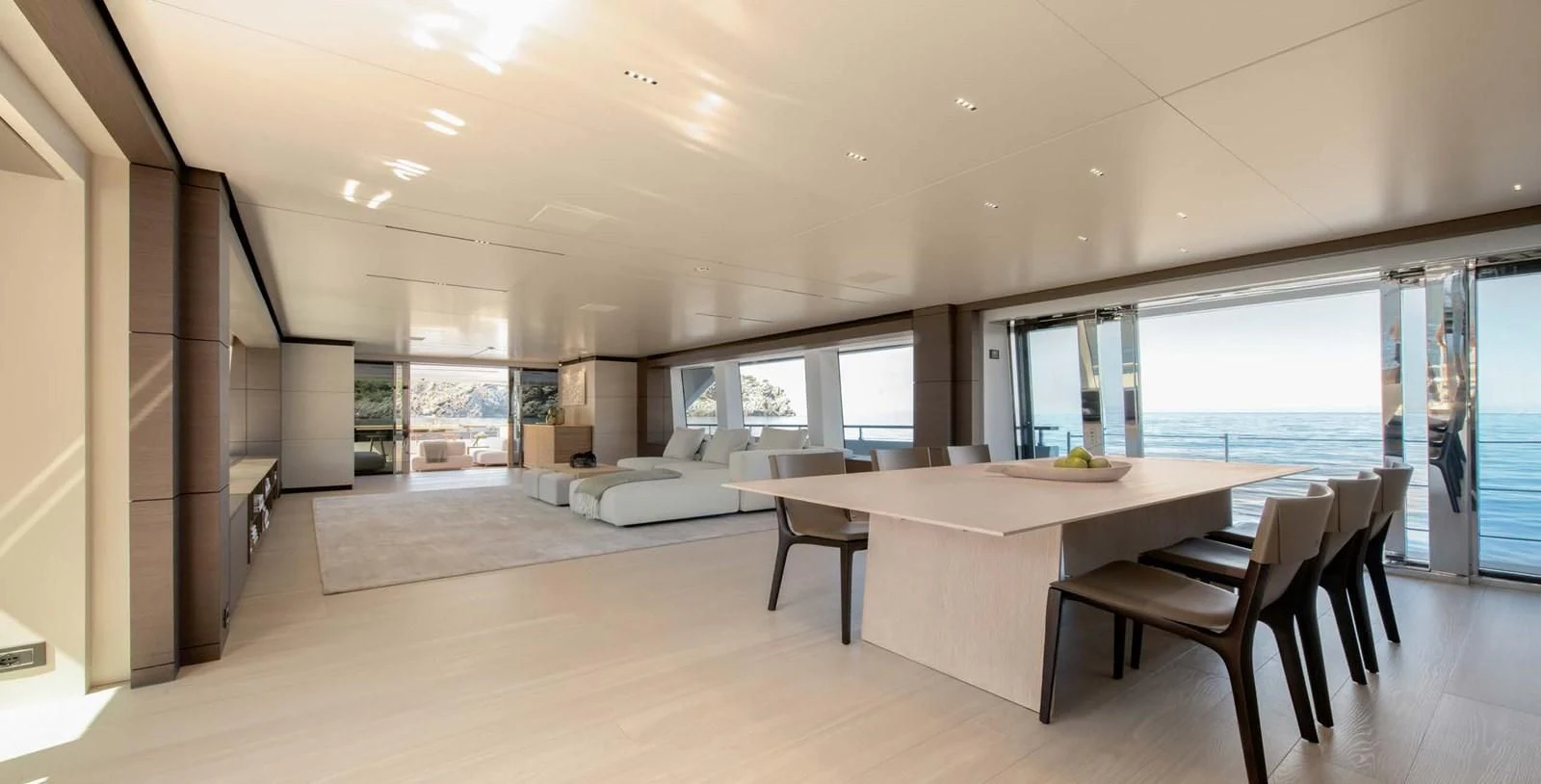 a large room with a table and chairs aboard PALOMA Yacht for Sale