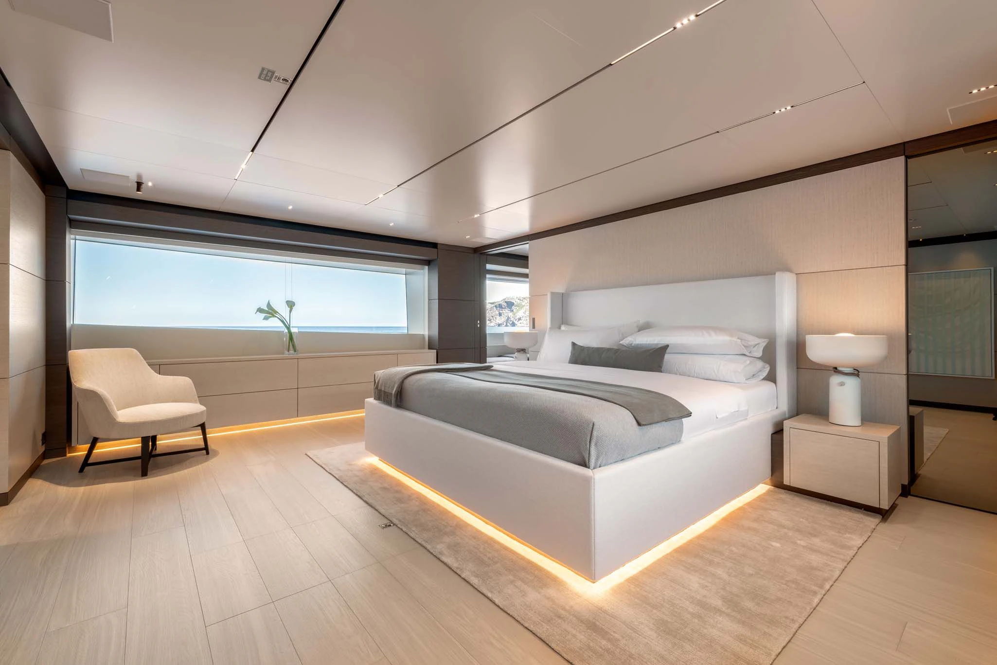 a modern bedroom with a large bed aboard PALOMA Yacht for Sale