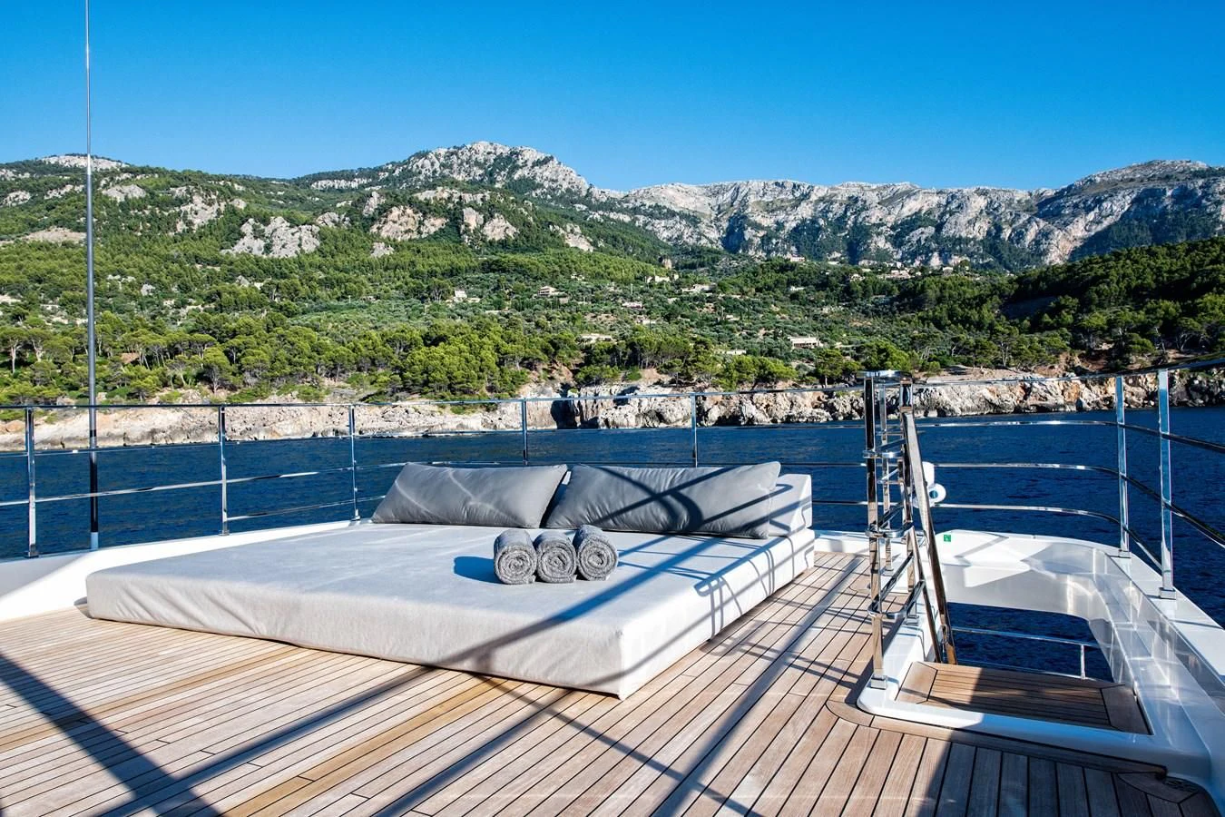 a roof with a view of mountains and water aboard PALOMA Yacht for Sale