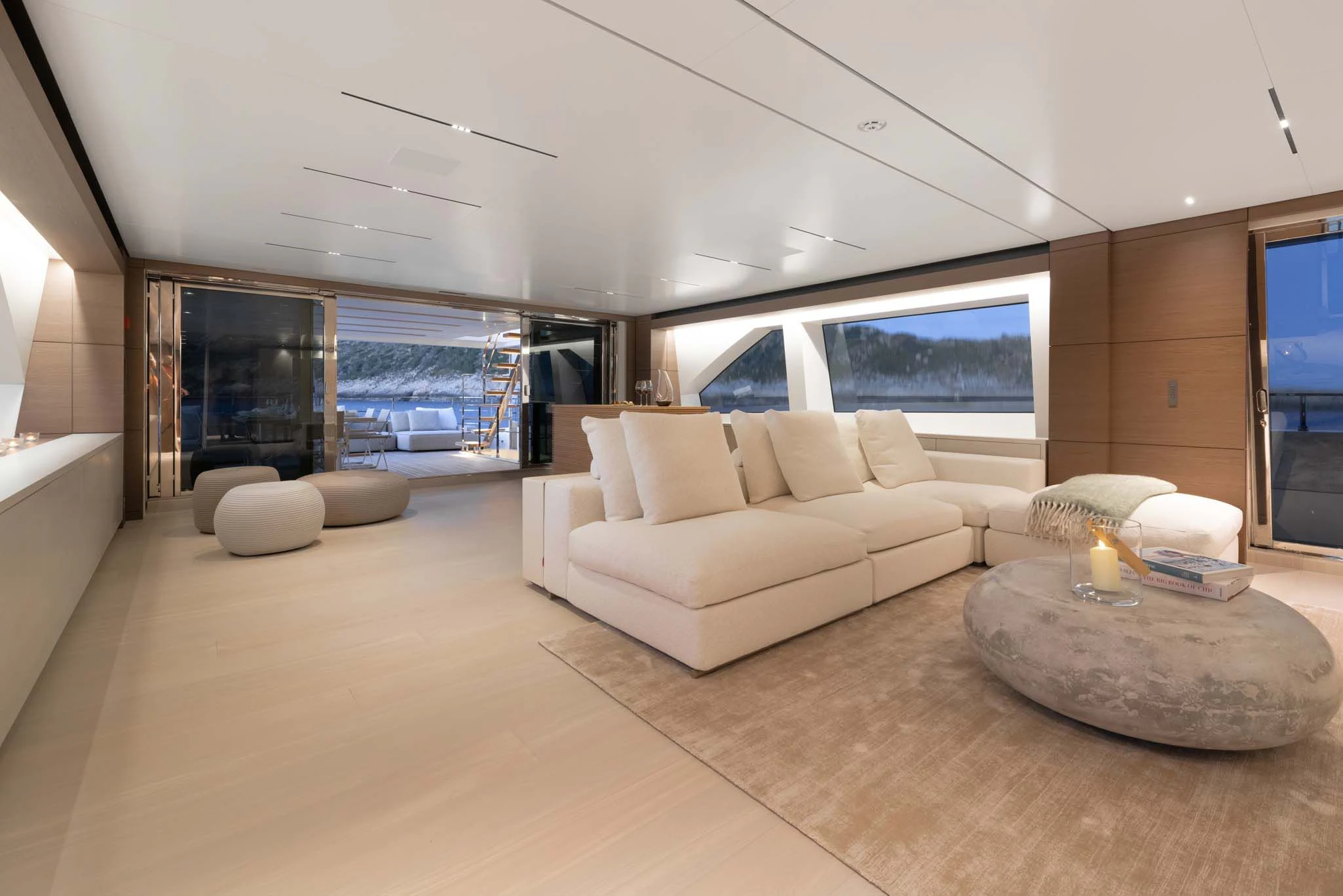 a living room with a large window aboard PALOMA Yacht for Sale