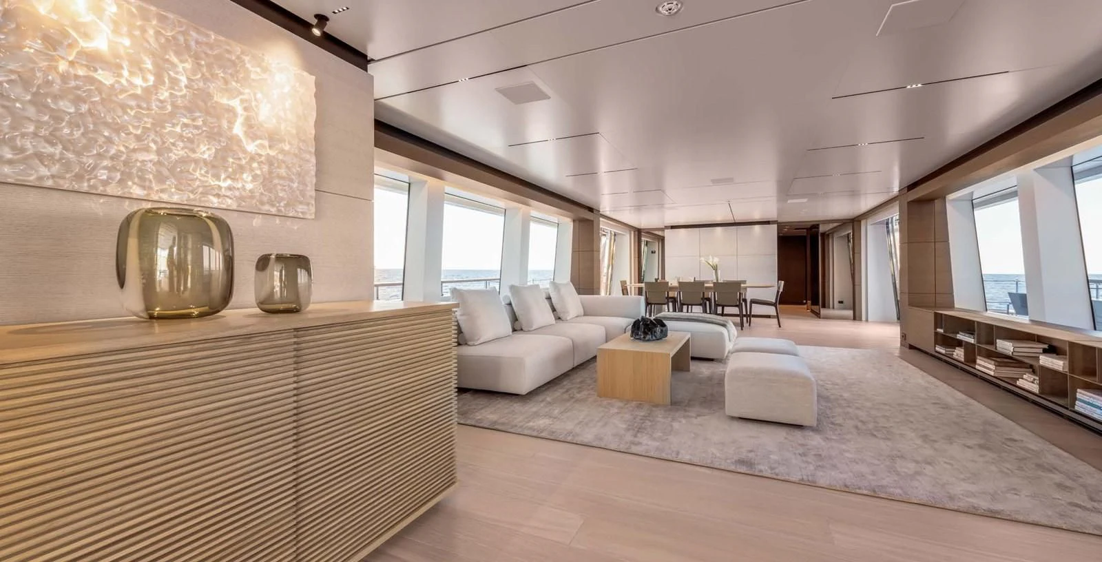 a large living room with a large mirror aboard PALOMA Yacht for Sale