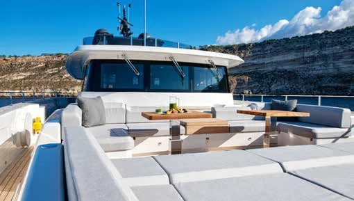 a white boat on a deck aboard PALOMA Yacht for Sale