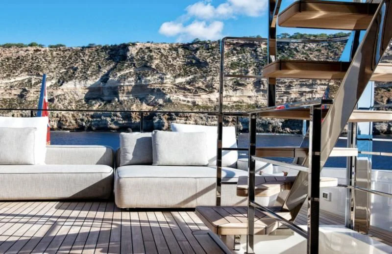 a deck with a couch and a view of a canyon aboard PALOMA Yacht for Sale