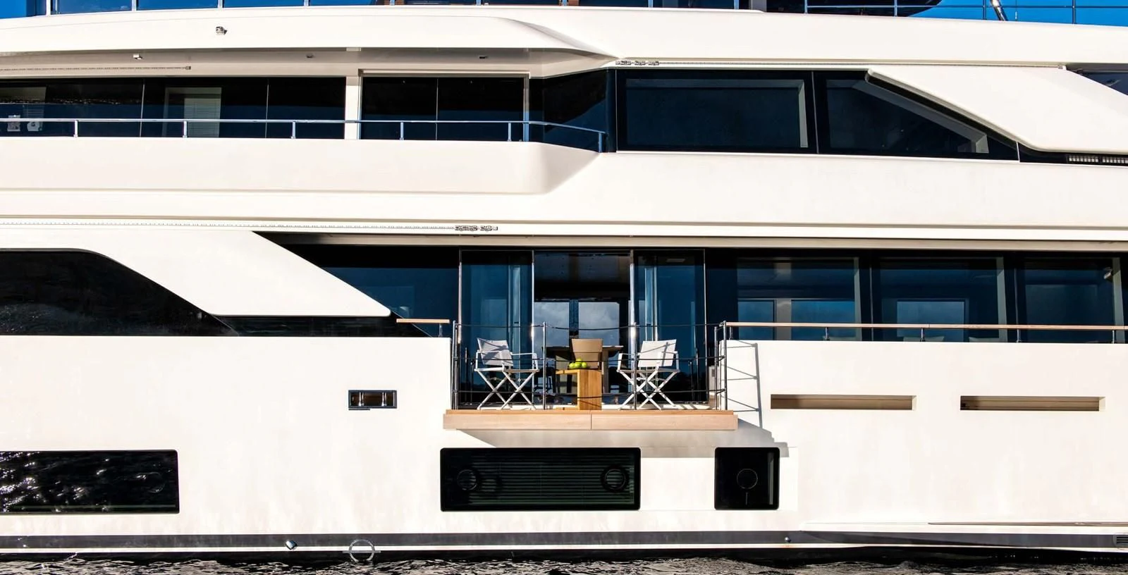 a white building with a black screen aboard PALOMA Yacht for Sale