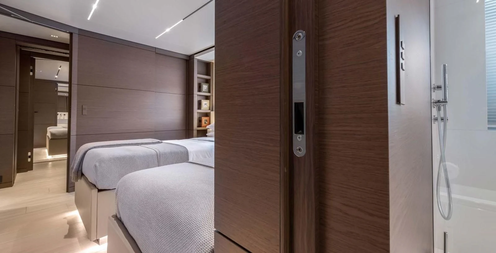 a room with a bed and a closet aboard PALOMA Yacht for Sale
