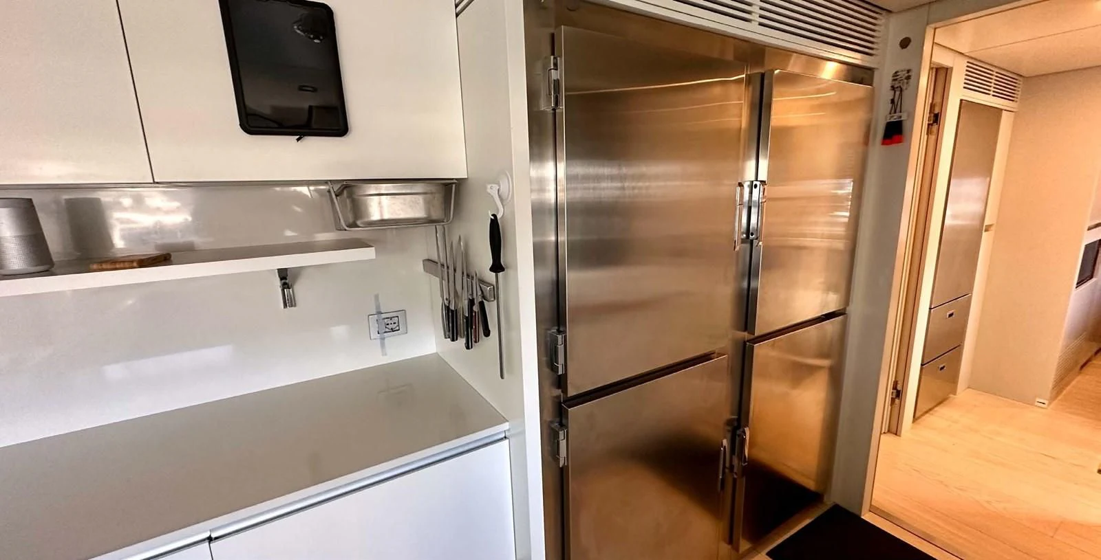 a refrigerator in a kitchen aboard PALOMA Yacht for Sale