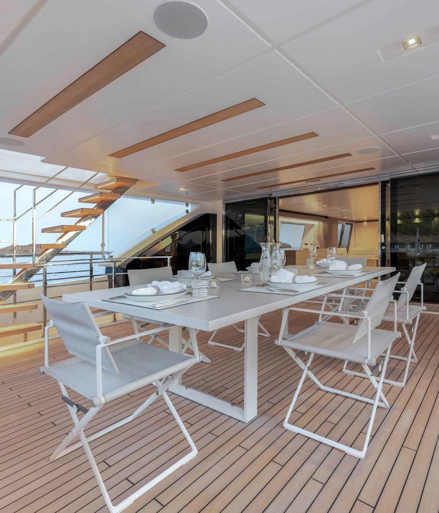 a room with tables and chairs aboard PALOMA Yacht for Sale