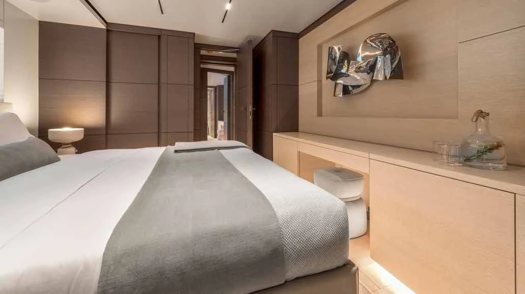 a modern bedroom with a large bed aboard PALOMA Yacht for Sale