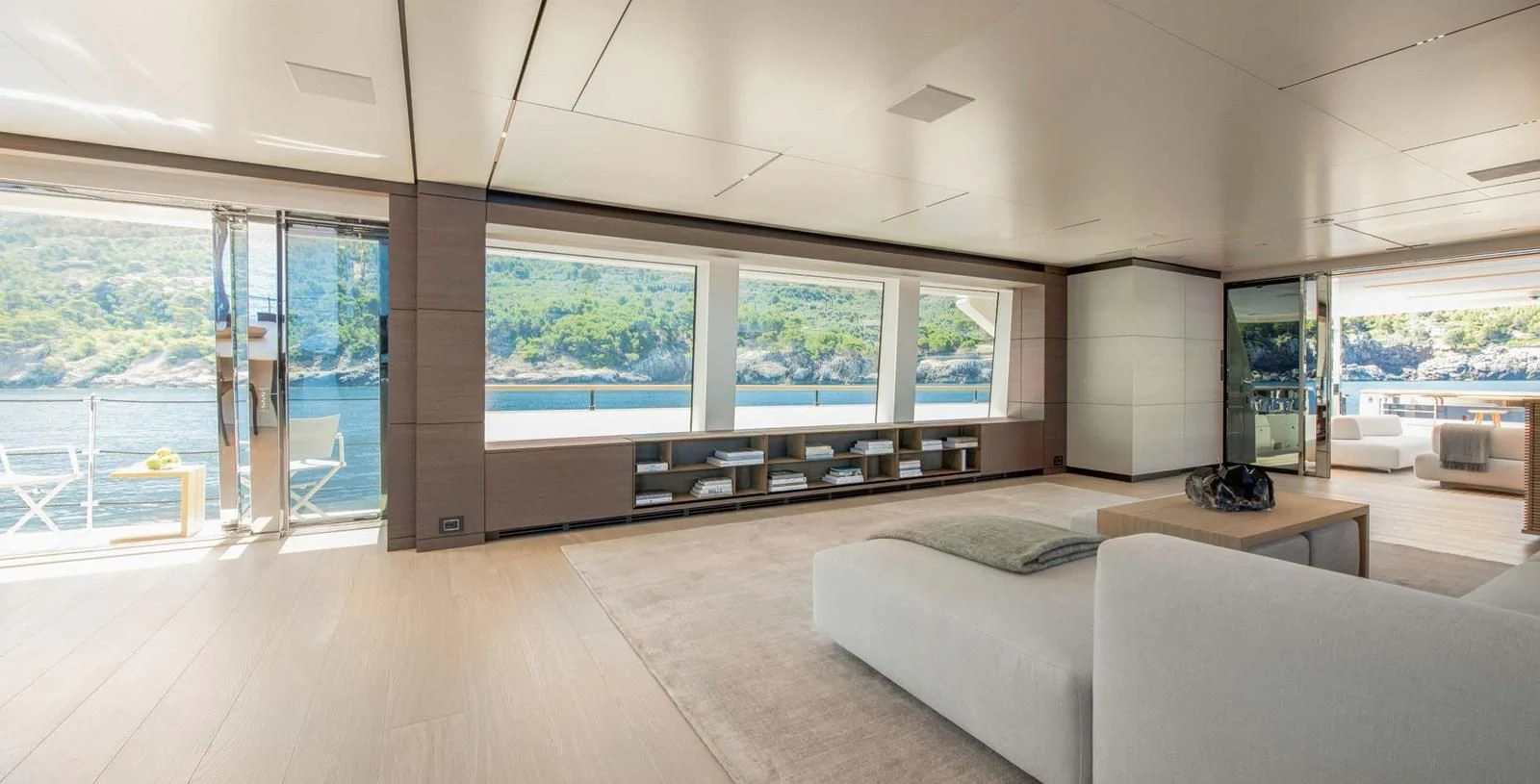 a living room with a large window aboard PALOMA Yacht for Sale