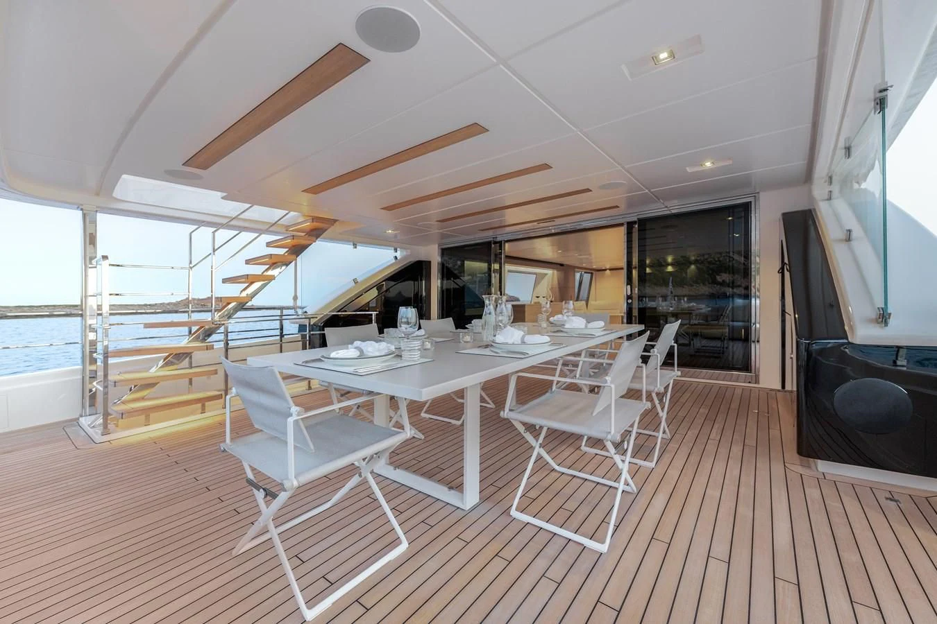 a room with tables and chairs aboard PALOMA Yacht for Sale