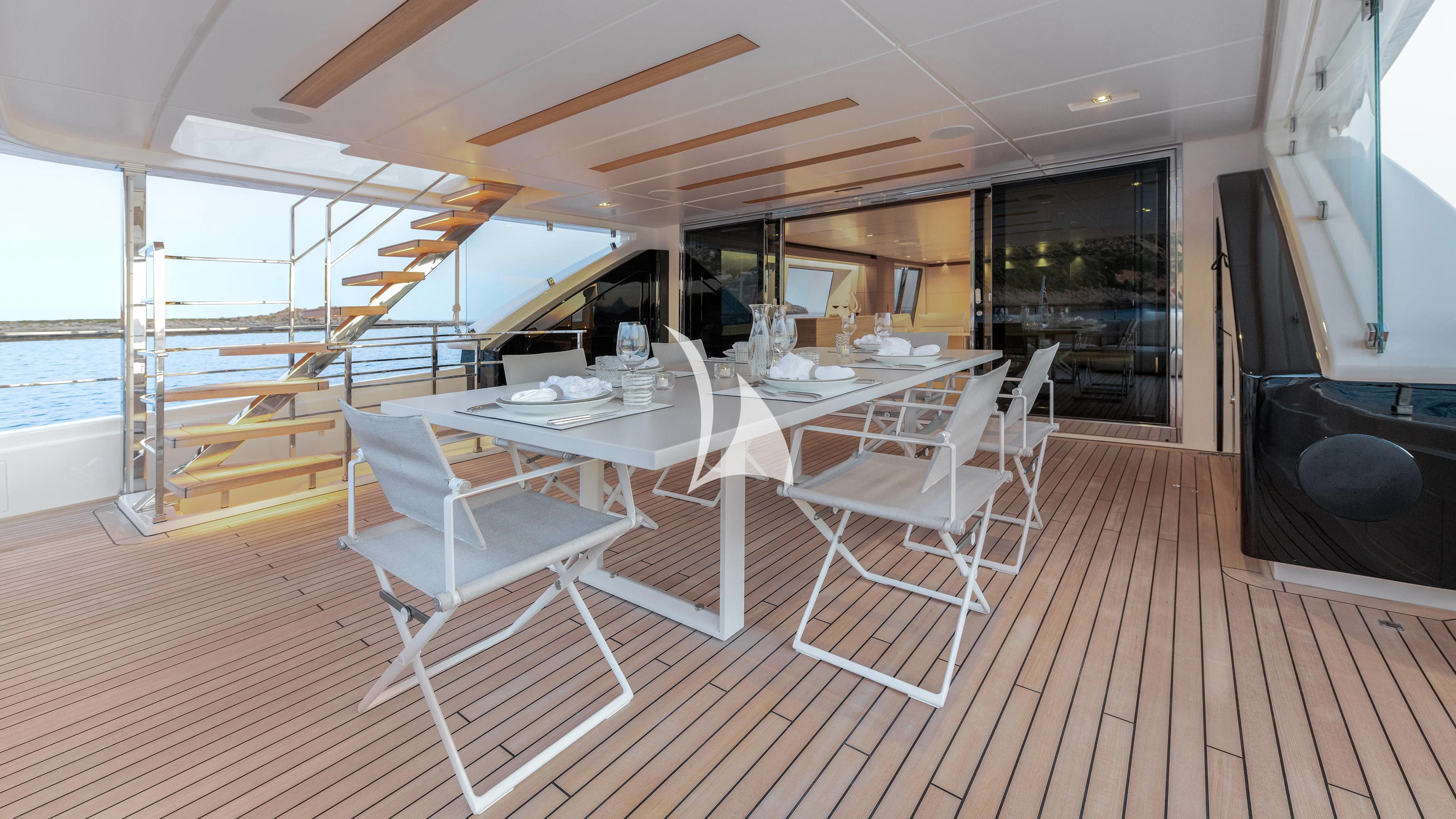 a room with tables and chairs aboard PALOMA Yacht for Sale