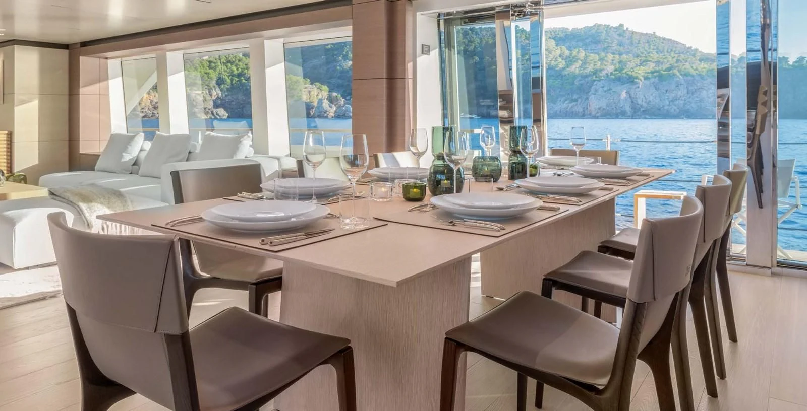 a table with plates and chairs aboard PALOMA Yacht for Sale