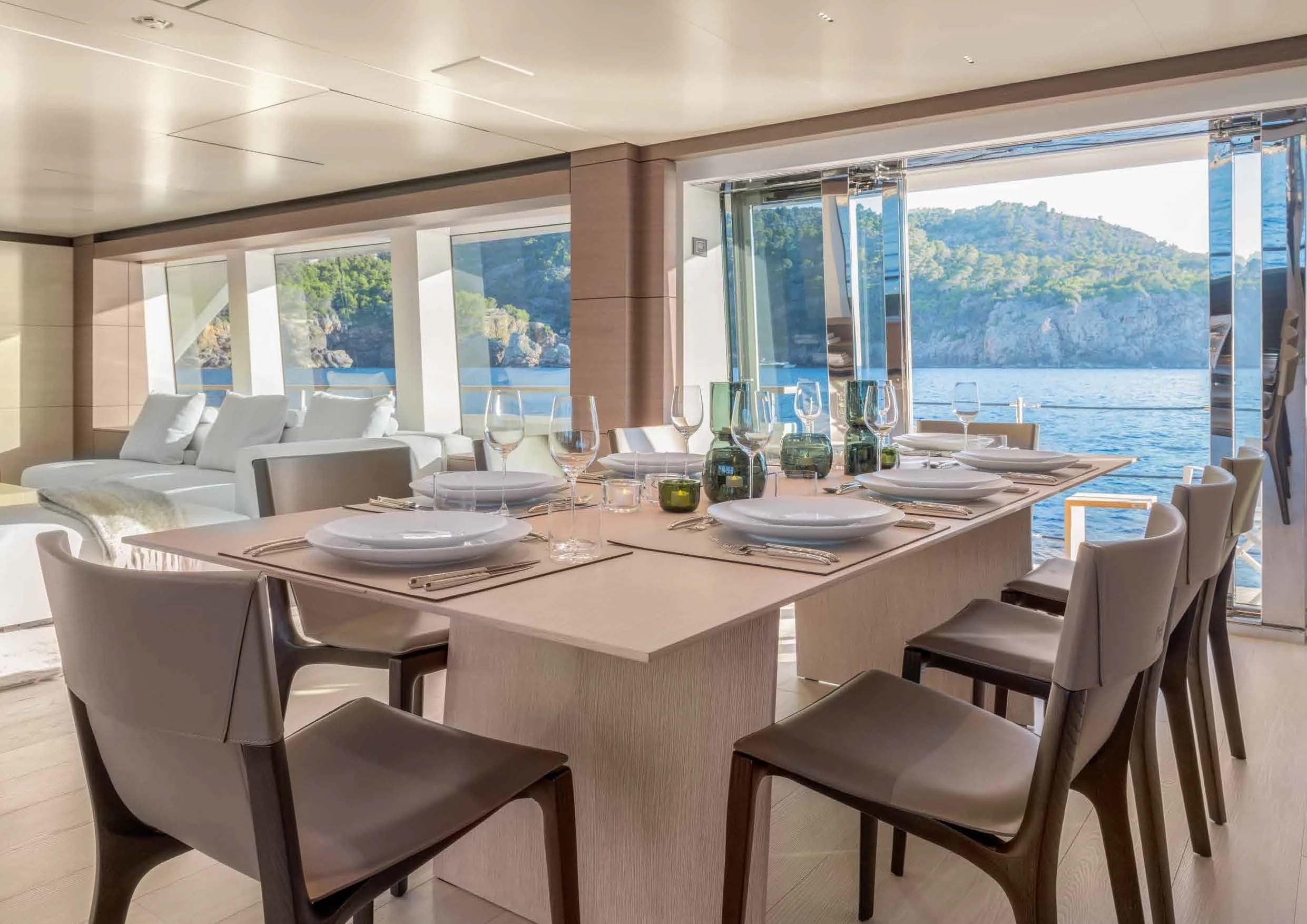 a dining table with chairs and a view of the city aboard PALOMA Yacht for Sale