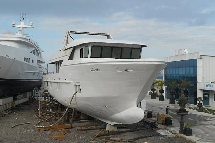 a couple of large boats are parked in a dock aboard APRIL V Yacht for Sale
