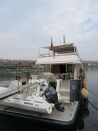 a boat docked at a pier aboard APRIL V Yacht for Sale