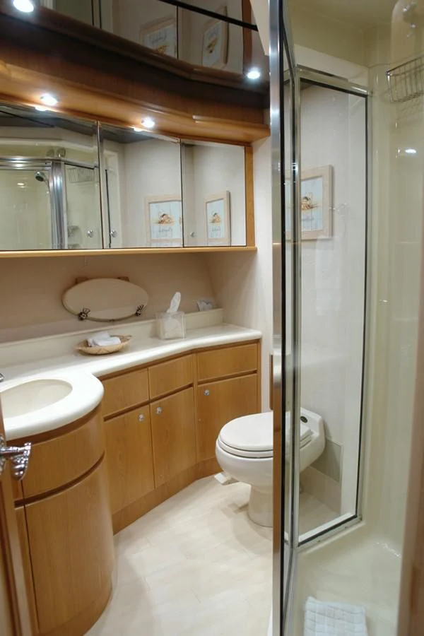 a bathroom with a glass shower door aboard SANTO ANTONIO Yacht for Sale