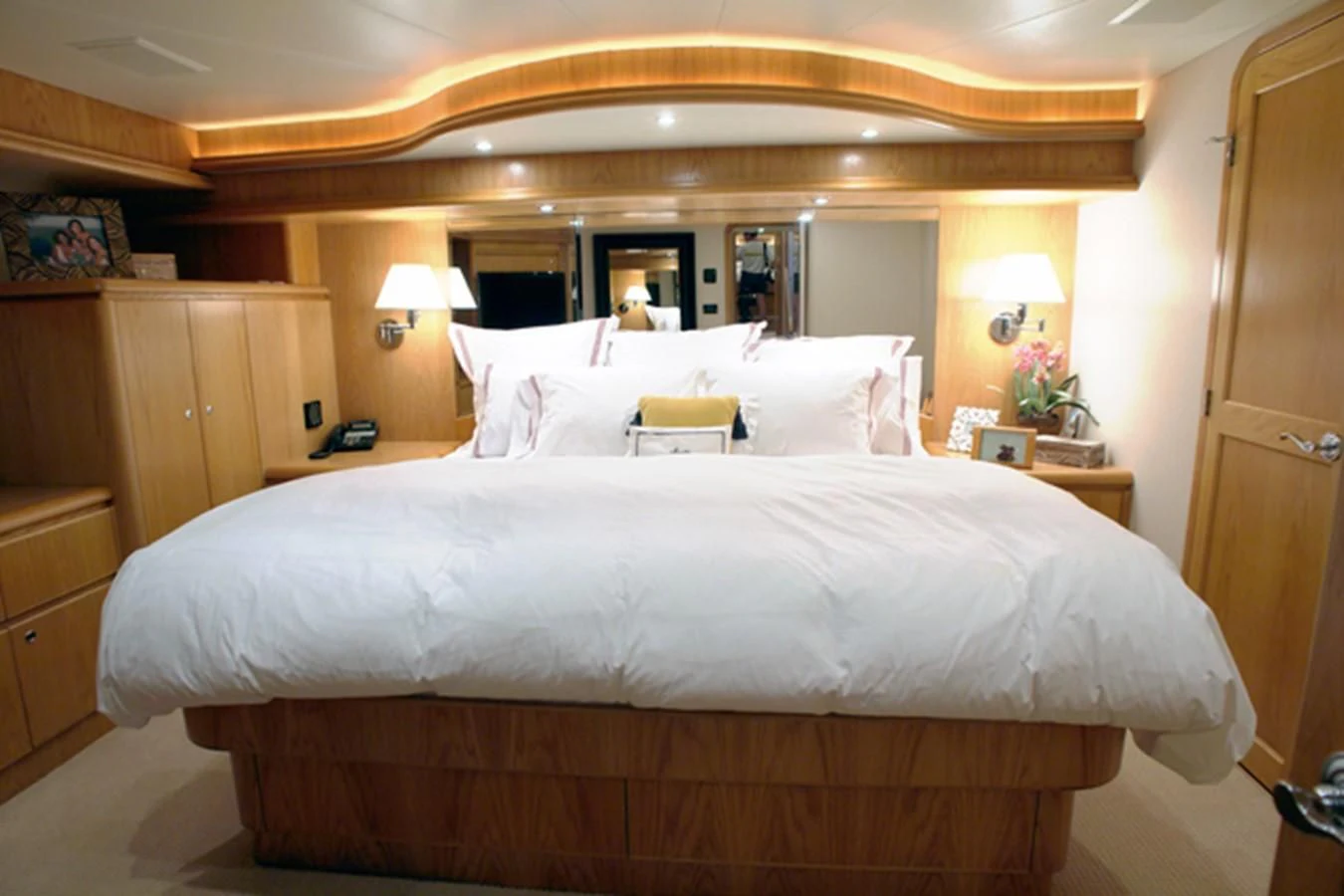 a hotel room with a large bed aboard SANTO ANTONIO Yacht for Sale