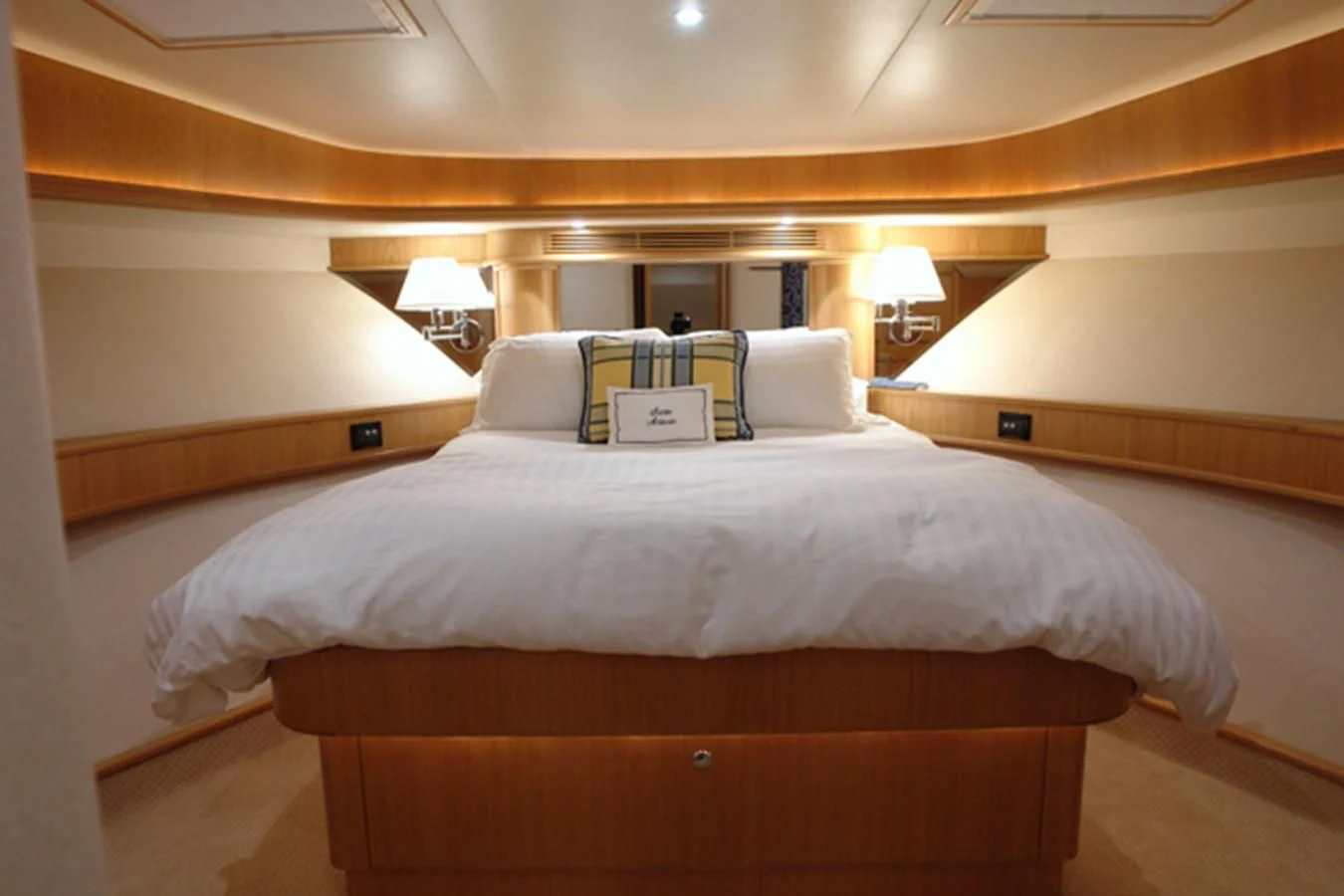a bed with a white pillow aboard SANTO ANTONIO Yacht for Sale