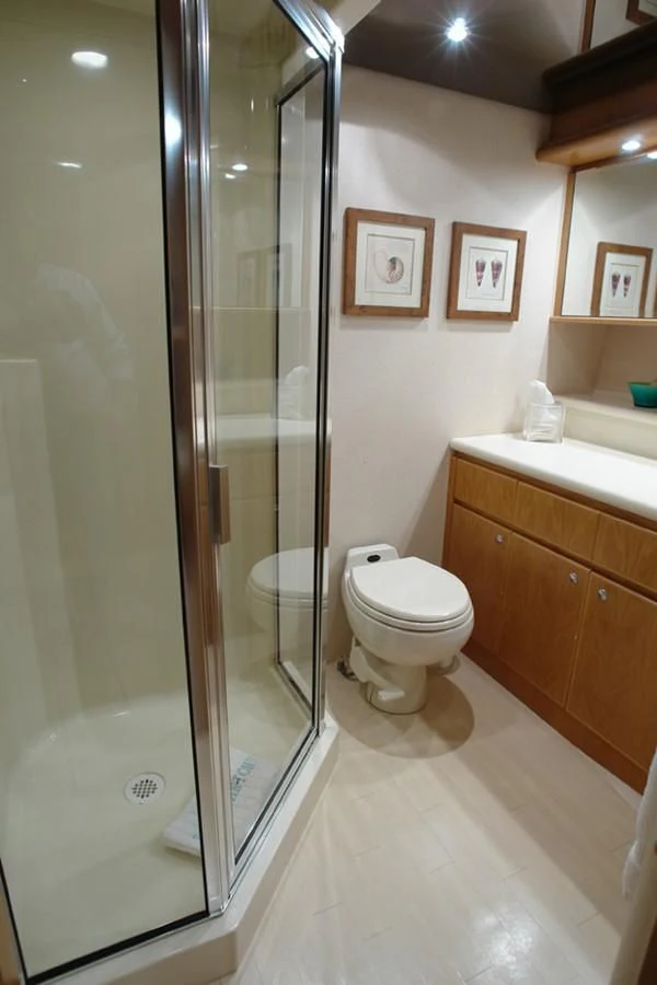 a bathroom with a glass shower aboard SANTO ANTONIO Yacht for Sale
