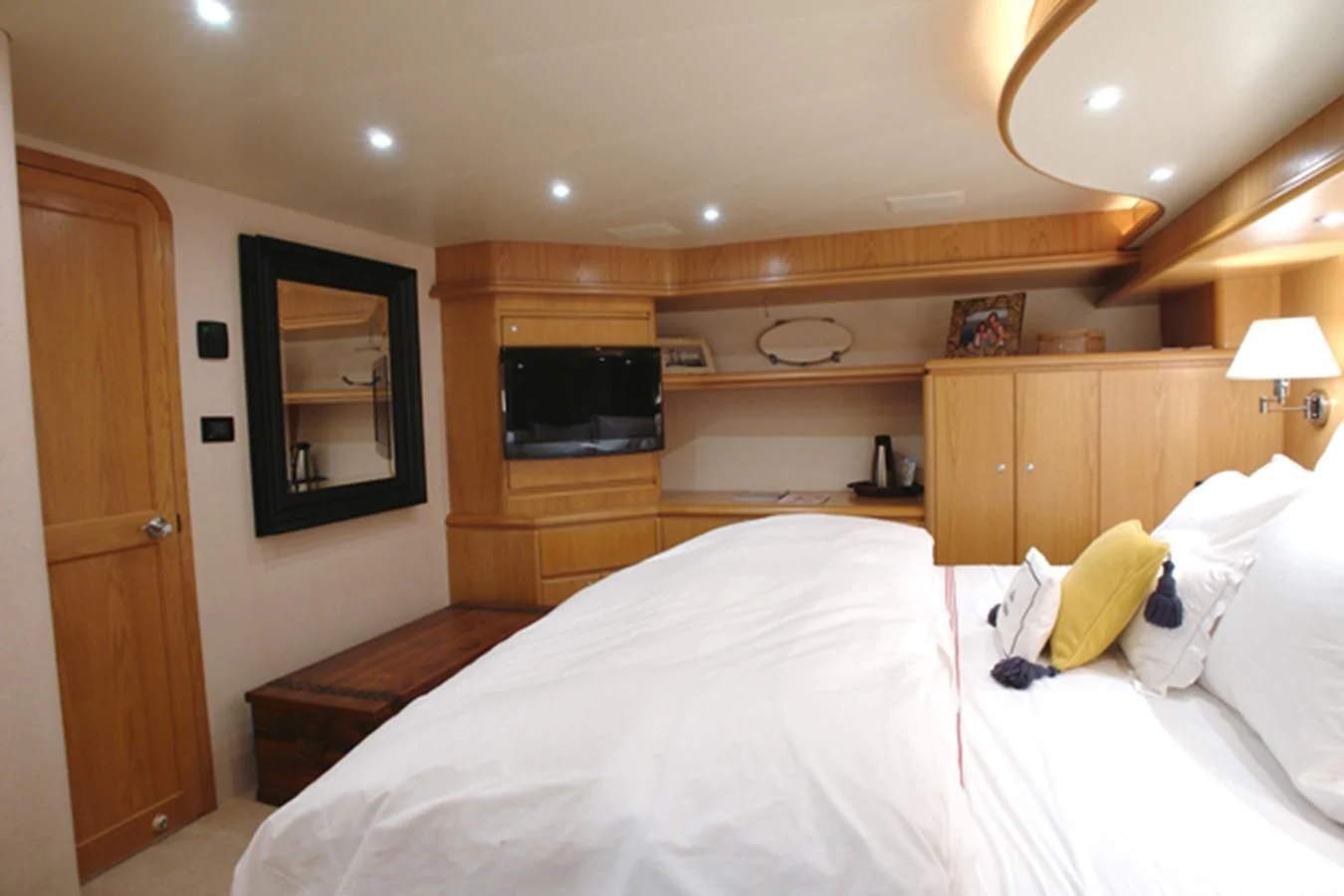 a bedroom with a bed and a television aboard SANTO ANTONIO Yacht for Sale