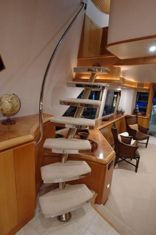 a kitchen with a wood table aboard SANTO ANTONIO Yacht for Sale