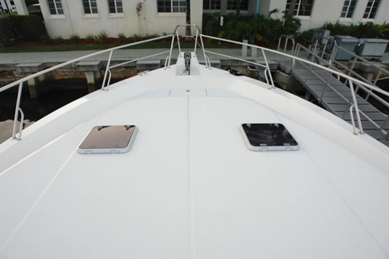 a white car with a screen on the hood aboard SANTO ANTONIO Yacht for Sale