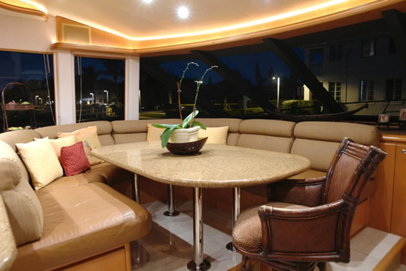 a room with a table and chairs aboard SANTO ANTONIO Yacht for Sale