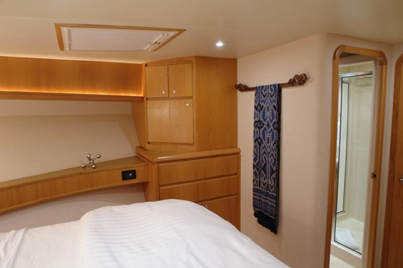 a bedroom with a closet and a bed aboard SANTO ANTONIO Yacht for Sale