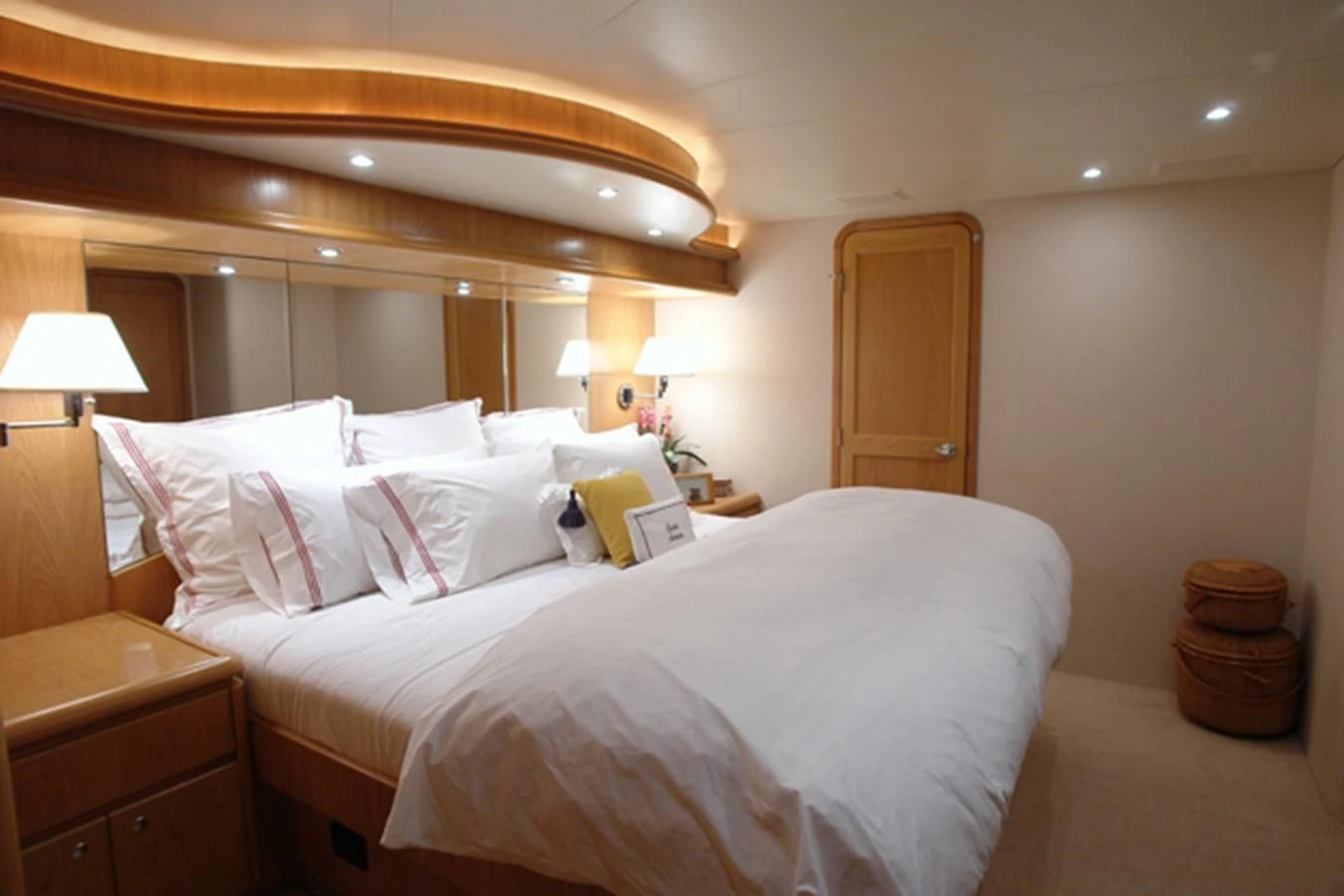 a bed with white sheets aboard SANTO ANTONIO Yacht for Sale