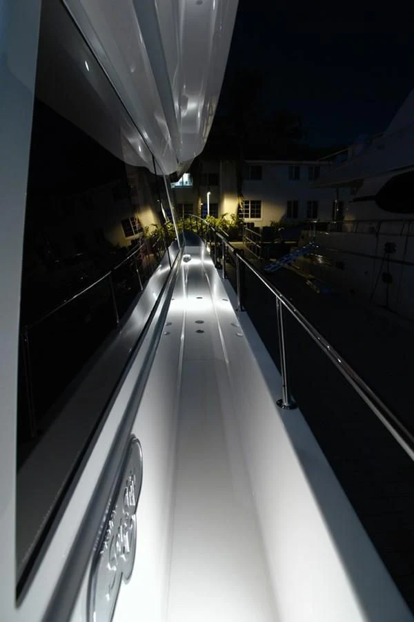 a long hallway with a white railing aboard SANTO ANTONIO Yacht for Sale