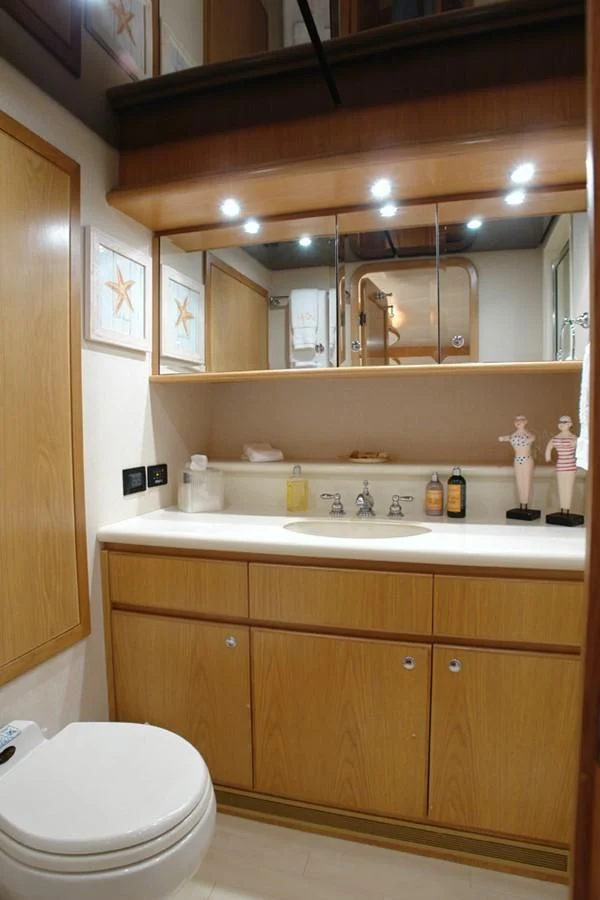 a bathroom with a toilet and a sink aboard SANTO ANTONIO Yacht for Sale