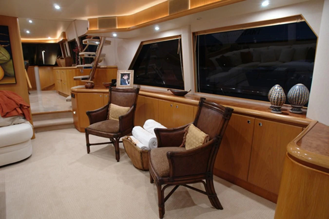 a room with a desk and chairs aboard SANTO ANTONIO Yacht for Sale